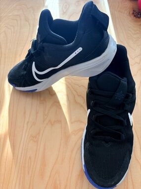 Nike Black and White Low-Top Basketball Shoes with Blue Accent